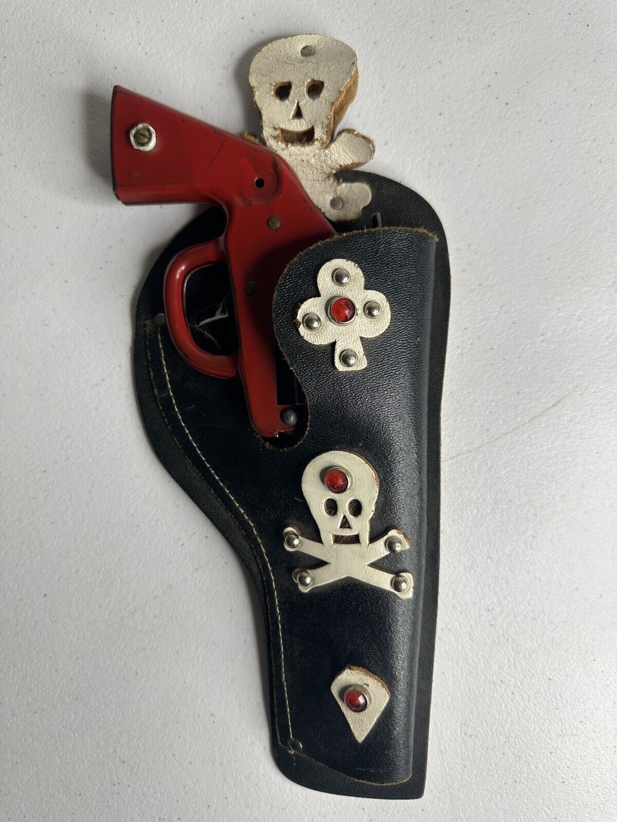 Vintage 1940s Wyandotte Pressed Steel Clicker Toy Gun with Skull and Crossbones Holster - 9.5 Inch Collectible - TreasuTiques